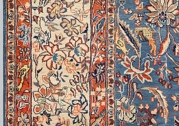 A figural Sarouk carpet, approx. 412 x 300 cm.