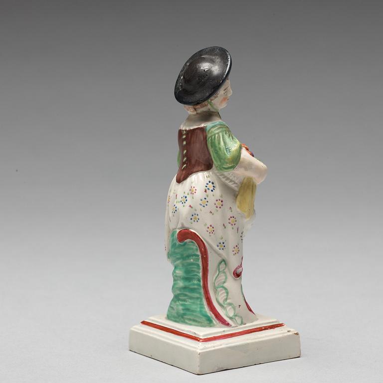 An English creamware figure representing Autumn, circa 1800.