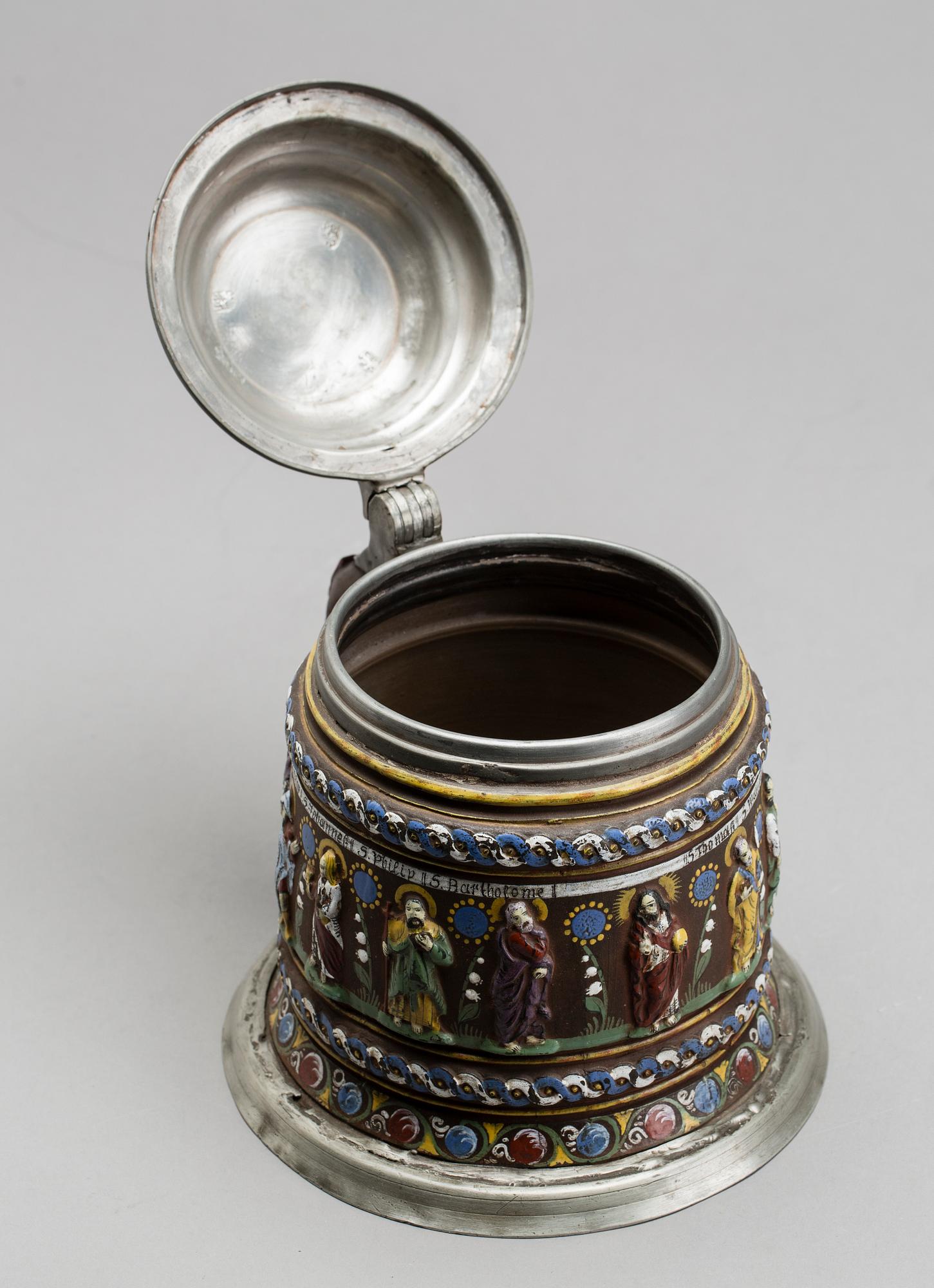 A GERMAN KREUSSEN STONEWARE APOSTLE STEIN TANKARD.