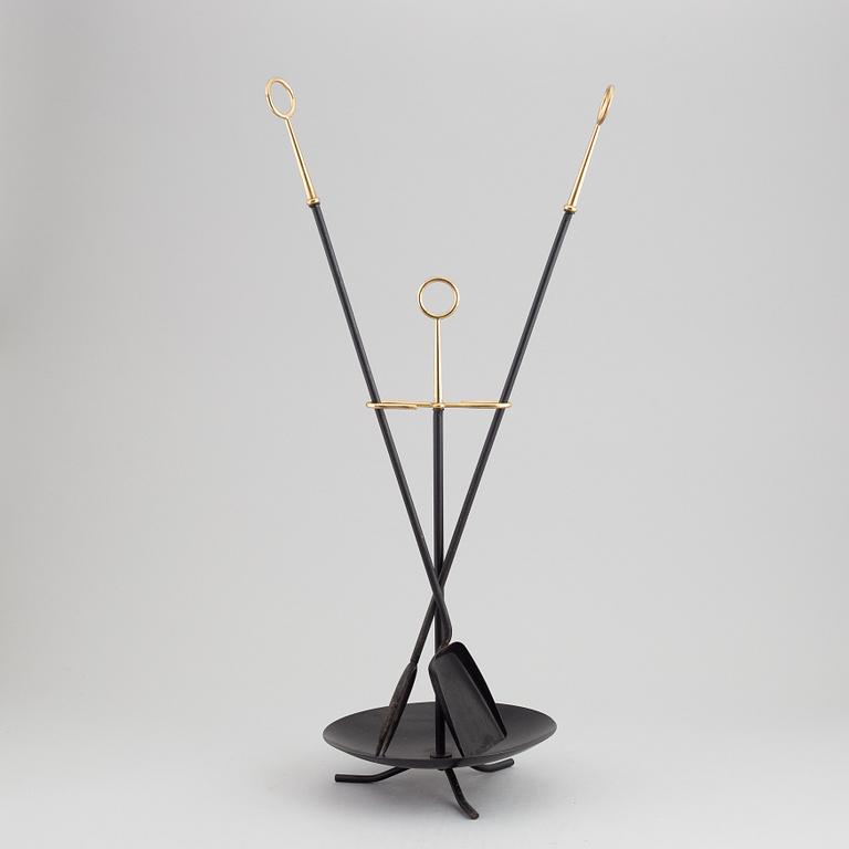 A fireplace stand of three parts by Gunnar Ander for Ystad Metall.