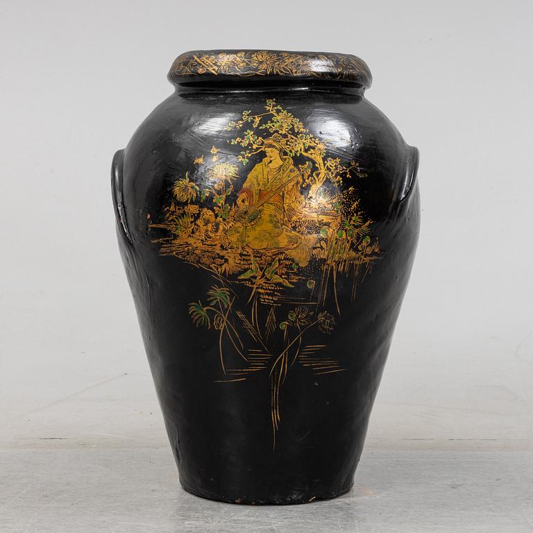 A 20th Century earhten ware urn.