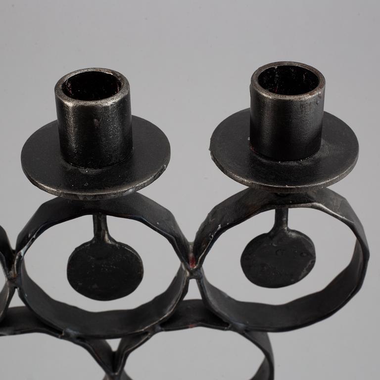 A cast iron candelabra by Bertil Vallien for Kosta Smide, Sweden.