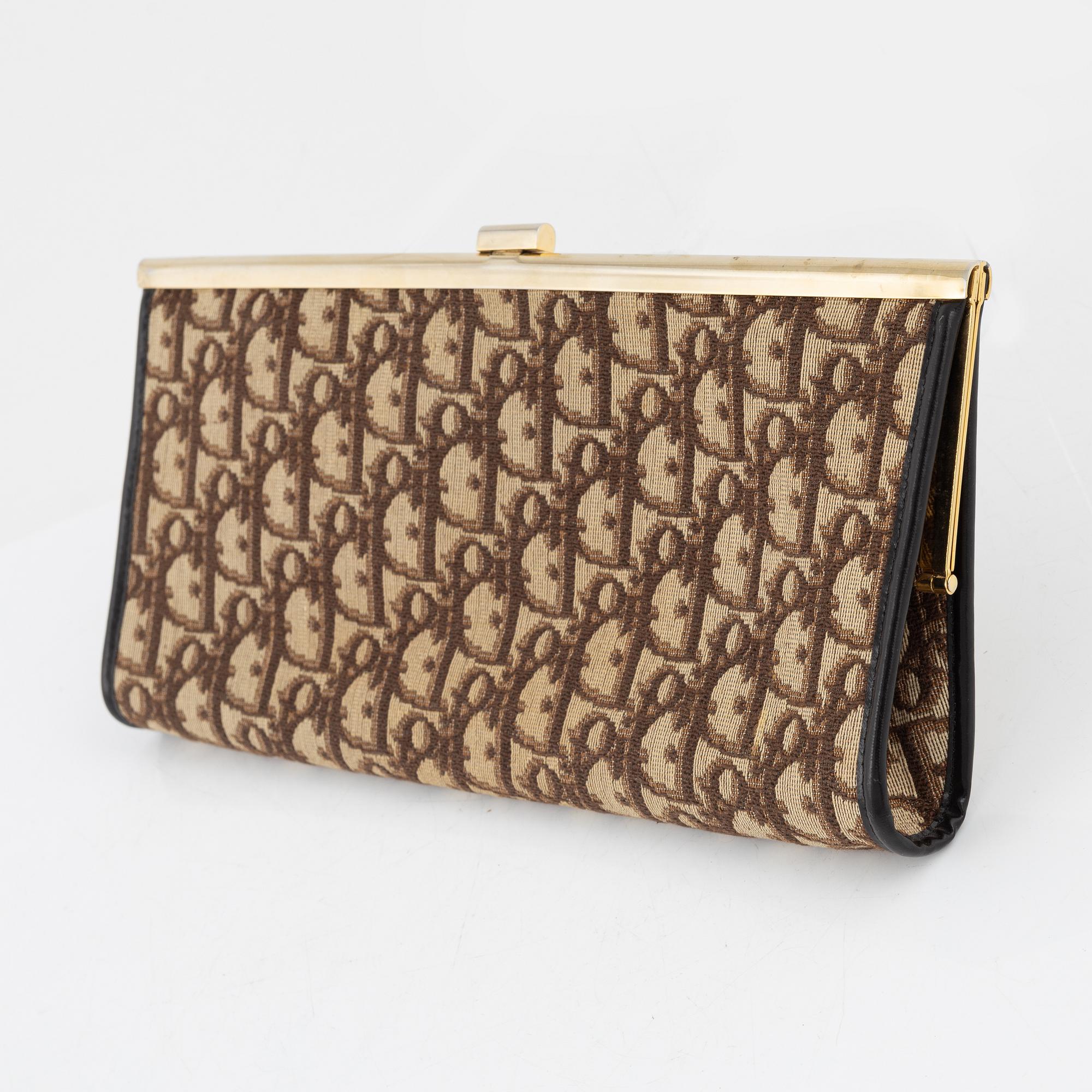 Christian Dior, a canvas clutch.