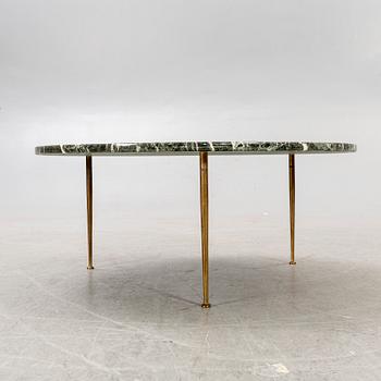 A marble coffee table alter part of the 20th century.