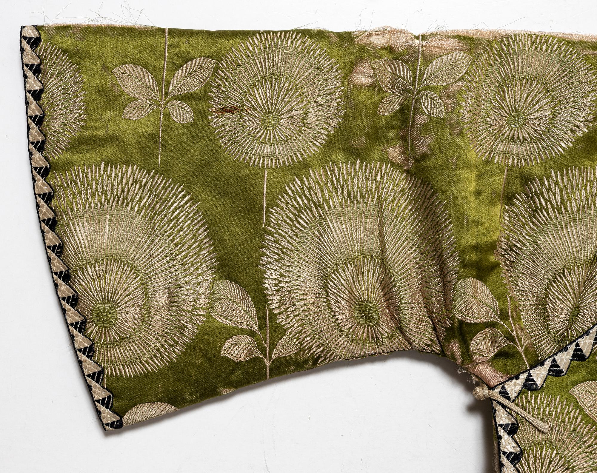 A Japanese silk brocade and fur childrens jacket, Meiji (1868-1912).