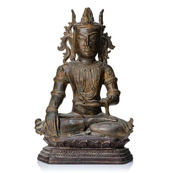 869. A Burmese bronze figure of a crowned buddha, 18th Century or older.