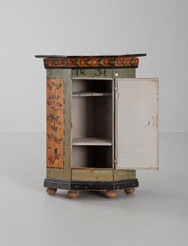 A Swedish wall cabinet dated 1831.