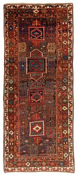 An antique Kurdish / Turkish carpet by the Herki Tribe, ca 276 x 116 cm.