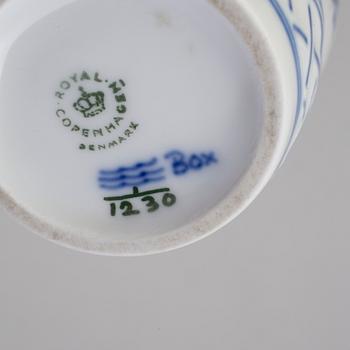 A pair of porcelain candlesticks and a lighter from Royal Copenhagen, Denmark.