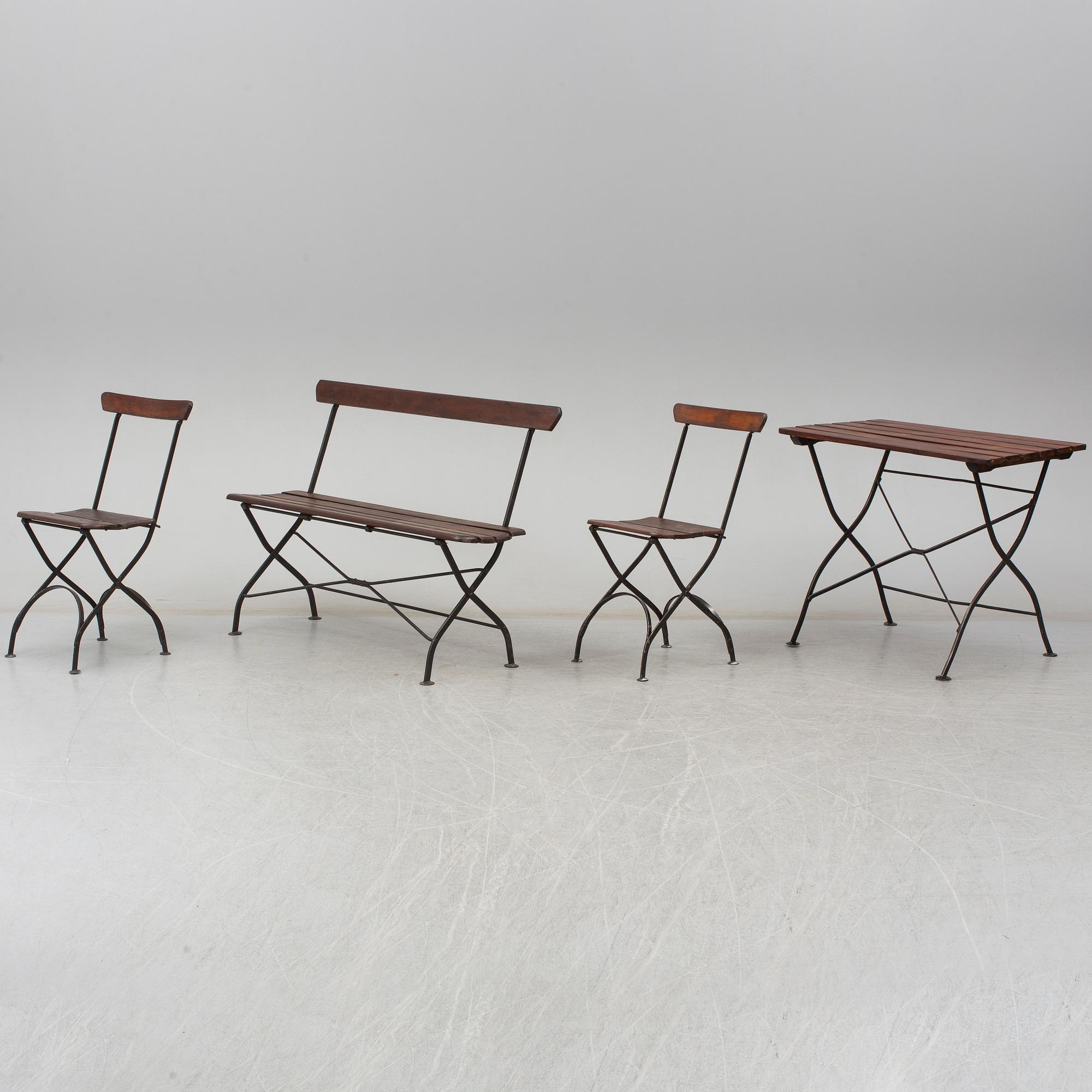 A garden sofa, table and a pair of chairs, first half of the 20th century.