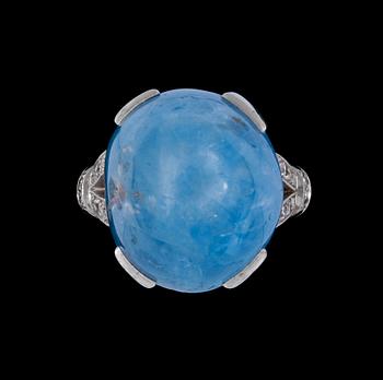 203. A cabochon cut blue sapphire, app. 30 cts, and diamond ring.