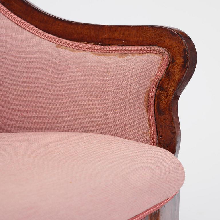 A pair of Baltic mahogany fauteuils, mid 19th century.