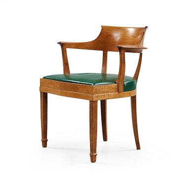 264. Alfred Grenander, a mahogany and green leather armchair, ca 1905.