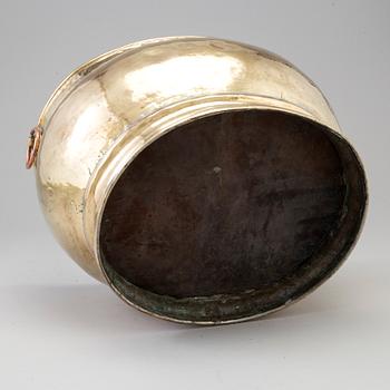 A 18th century brass champagne cooler.