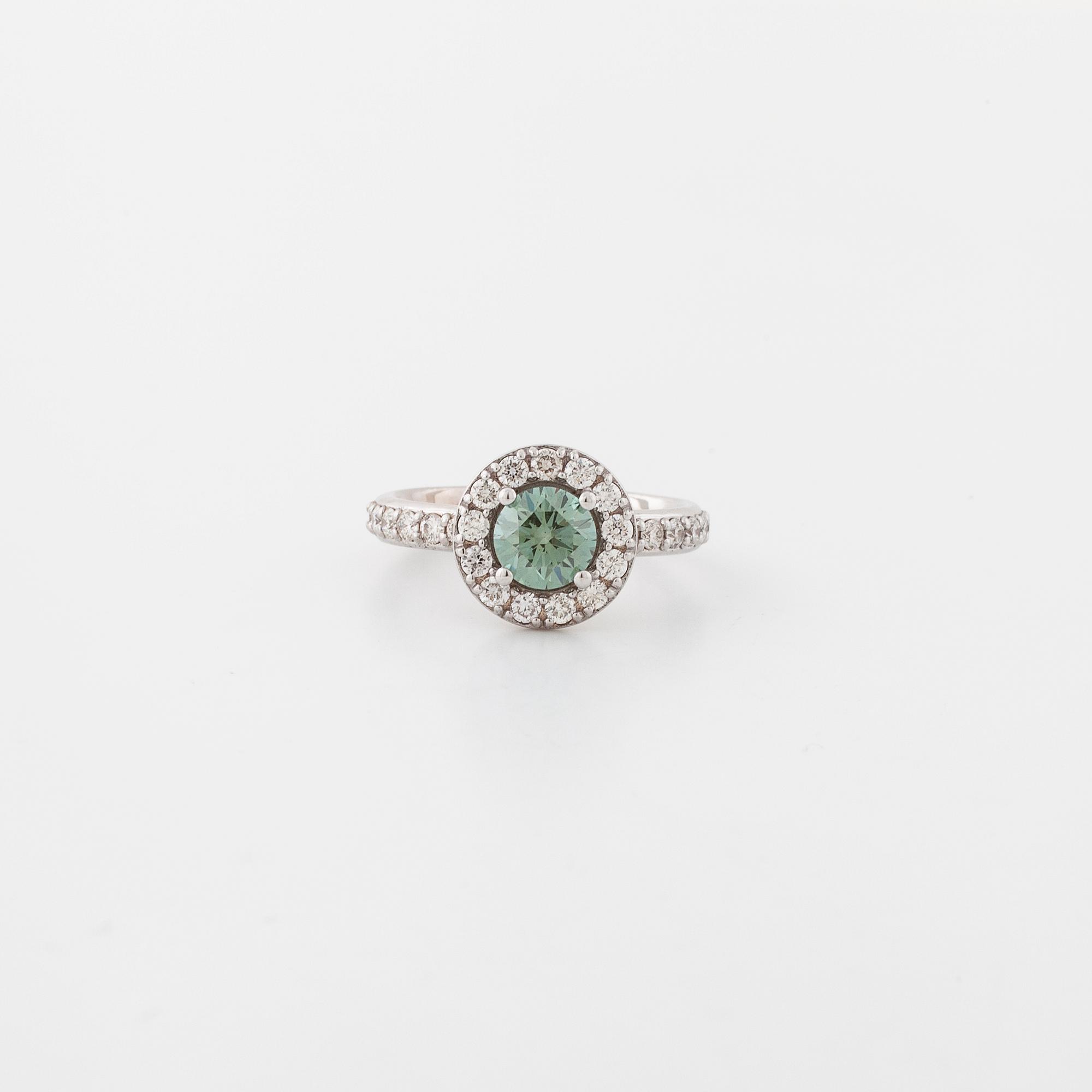A treated green diamond and briliant cut diamonds.