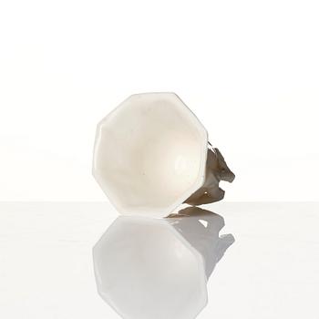 A lacquer tea box and a blanc de chine cup, Qing dynasty 18/19th century.