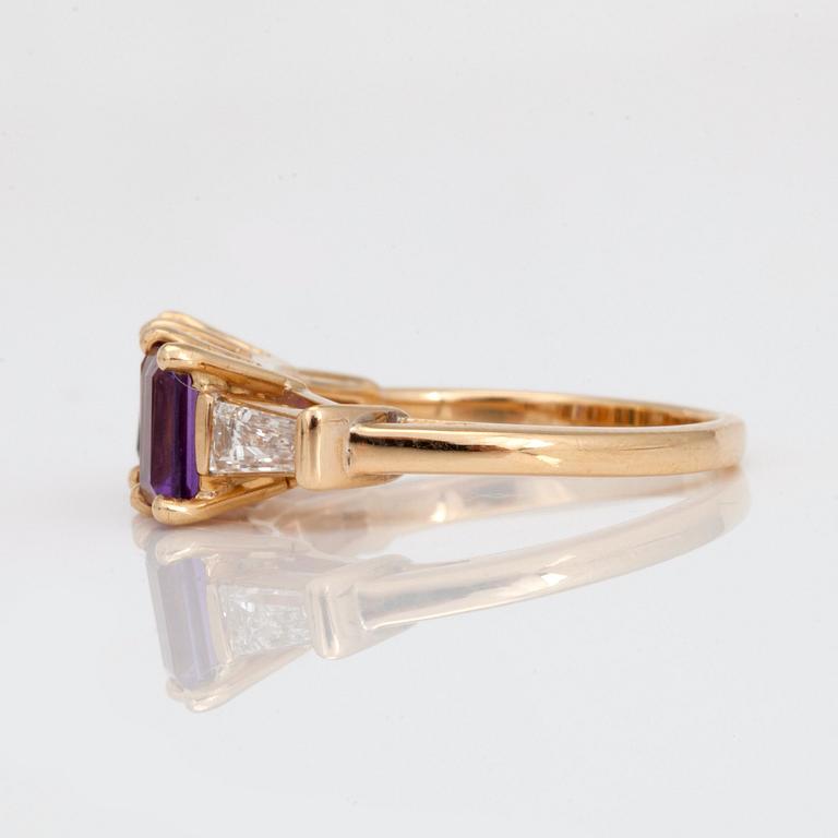 A step-cut tourmaline, amethyst, citrine and trapeze-cut diamond ring.