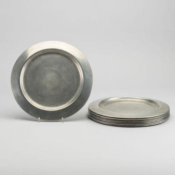 FIRMA SVENSKT TENN, A set of eight 1960s pewter plates by Firma Svenskt Tenn.