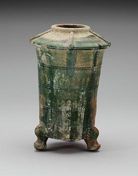 A green glazed pottery silo, Han dynasty (206 BC - 220 AD).