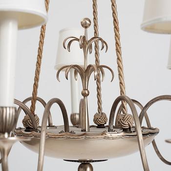 Swedish Grace, a silver plated ceiling lamp for nine lights, 1920's.