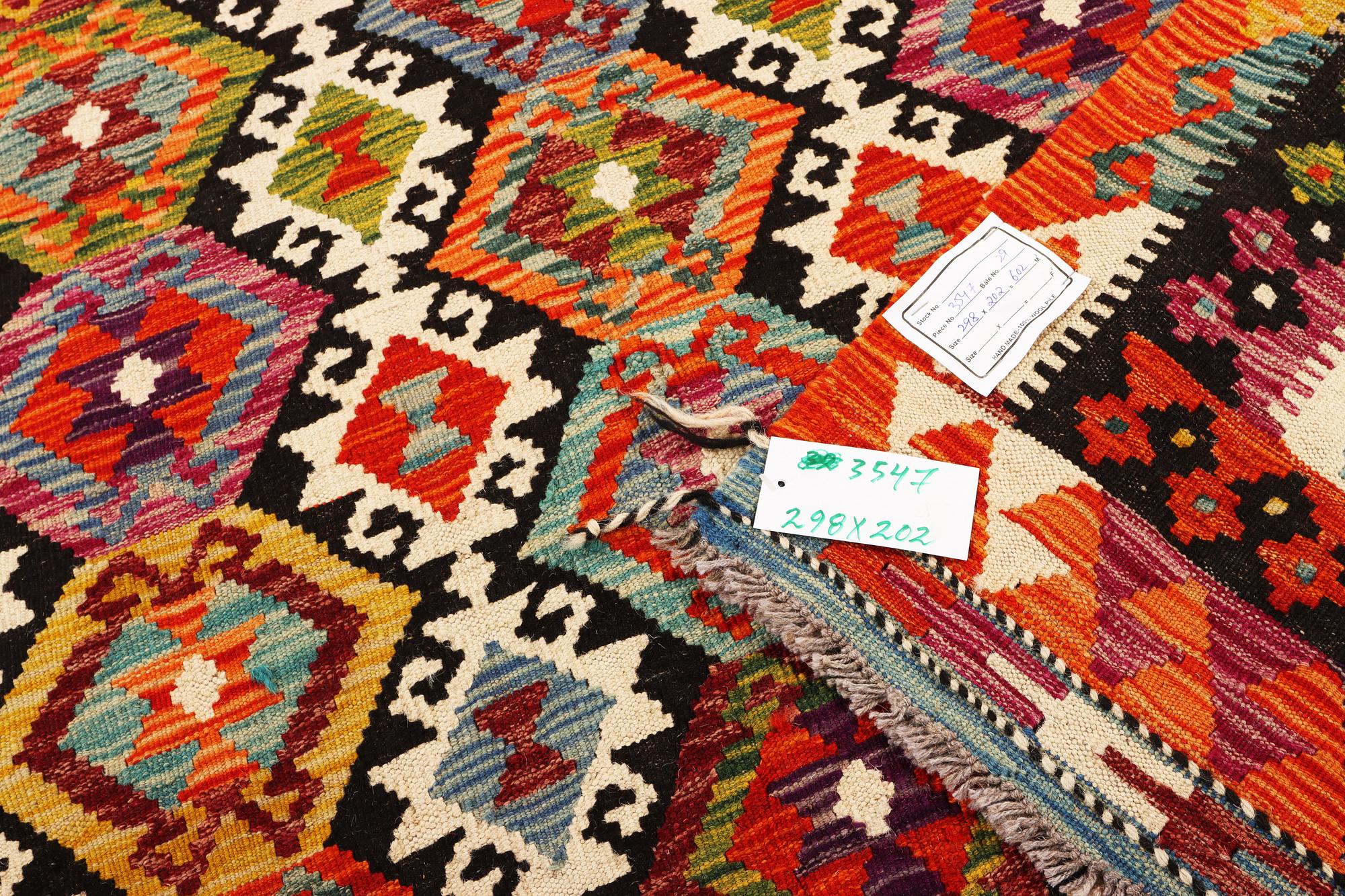 An Afghan Kilim carpet, c. 298 x 202 cm.