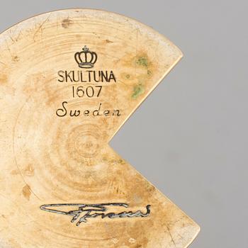 A brass candle holder by Pierre Forssell for Skultuna.