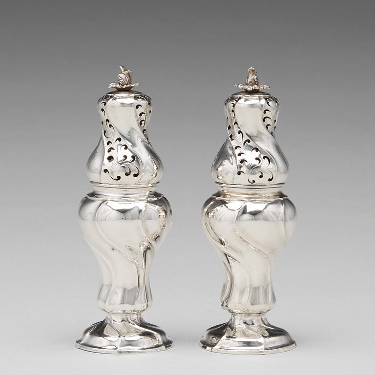 A matched pair of Swedish Rokoko silver sugar-casters, one marked Olof Gravander, Kristinehamn 1764, one a later copie.