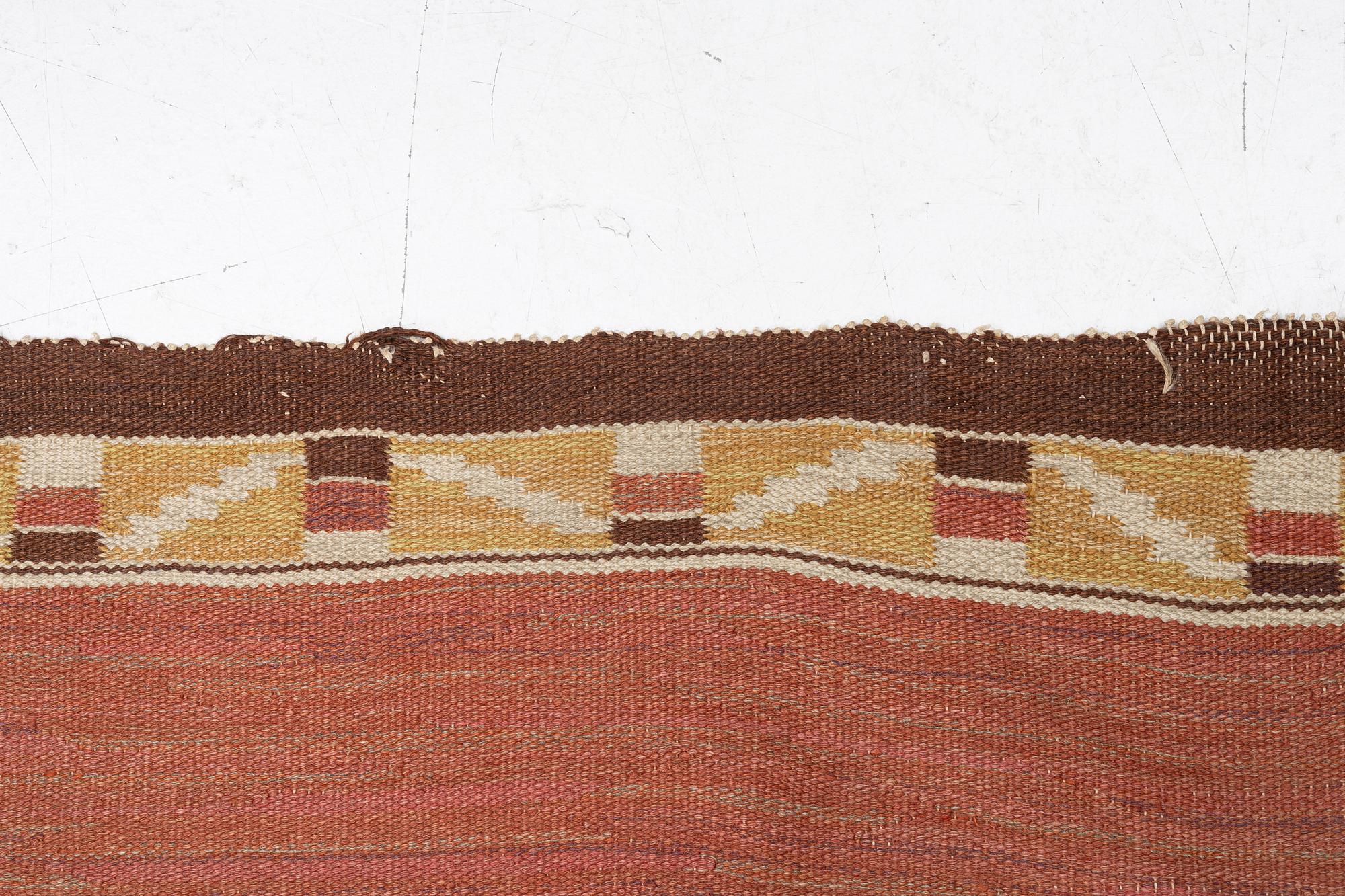 A flat weave carpet, c. 360 x 265 cm.