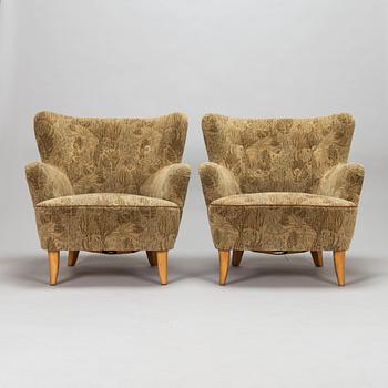 A pair of 1950s armchairs.