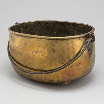 An 18th century brass cauldron.