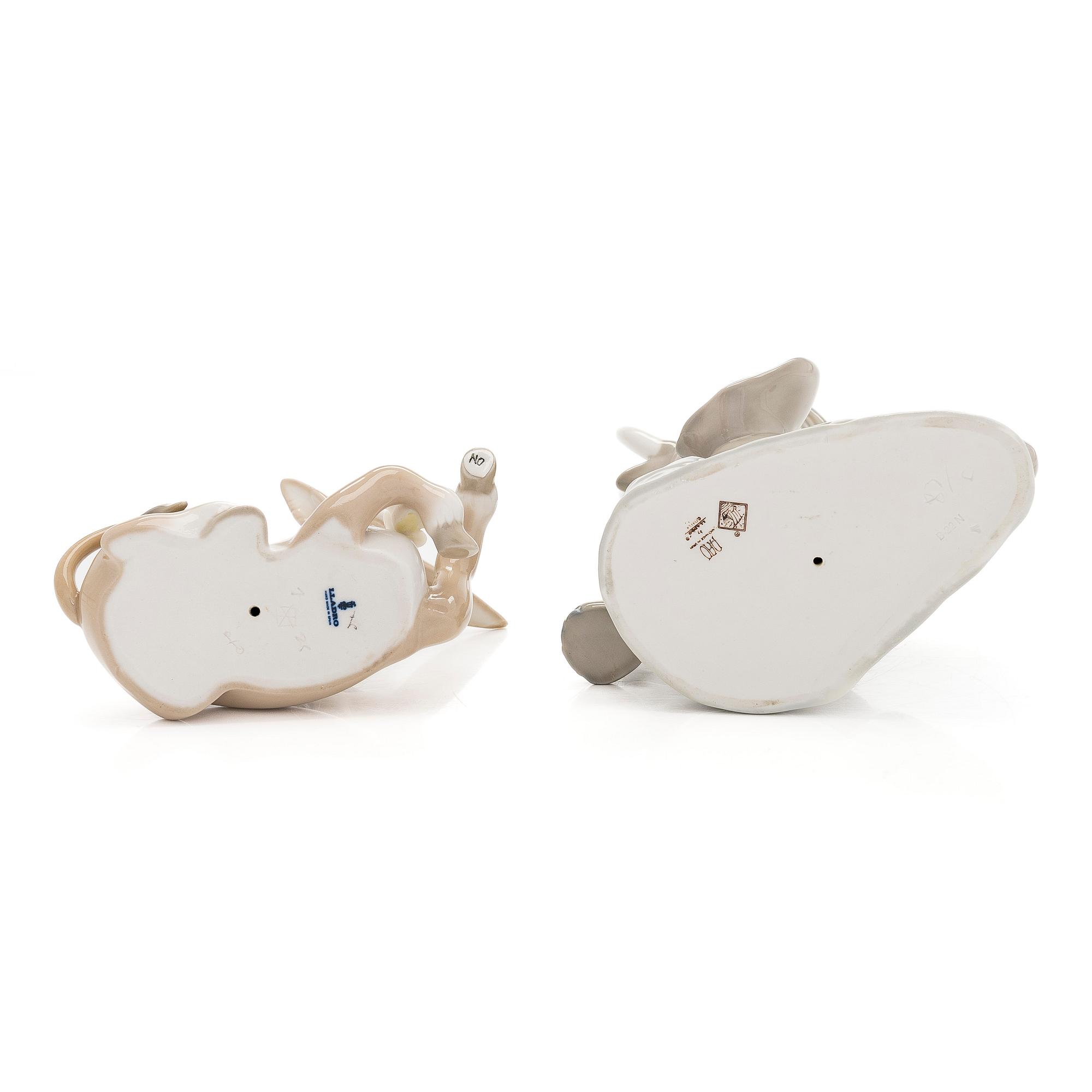 Lladró, two porcelain figurines, Donkey in Love and Trumpeting Elephant.