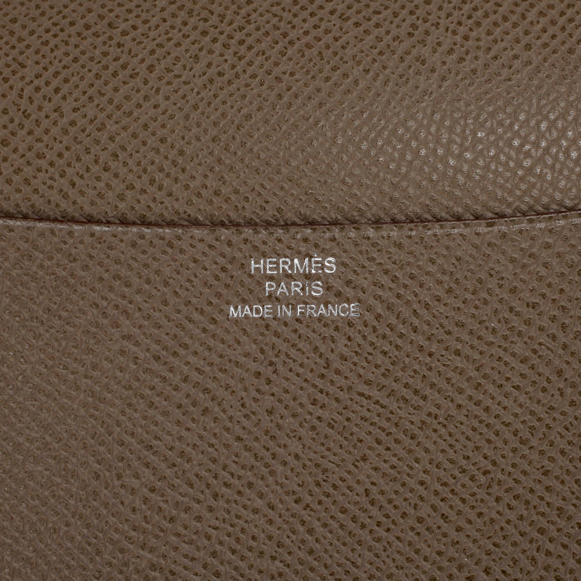 HERMÈS, a grey leather agenda cover, "Globe Trotter".