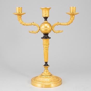 An empire ormolu candelabrum, early 19th century.