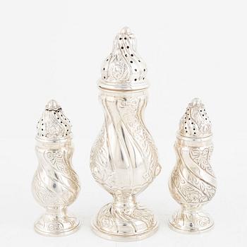 A set of three silver Rococo style shakers, 20th Century.