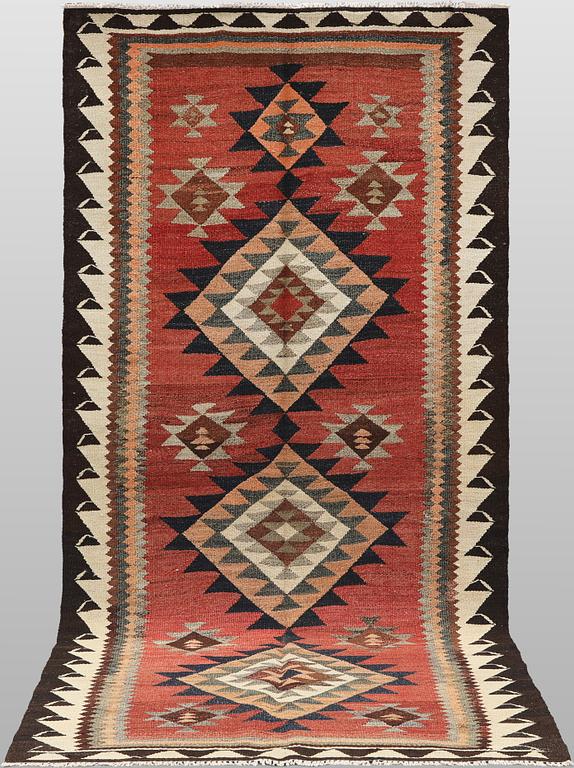 A Nomad Kurdish kilim rug, 270 x 132 cm.