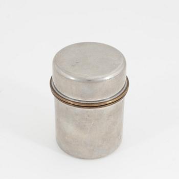 Estrid Ericson, A pewter and brass jar with cover, Firma Svenskt Tenn, Stockholm, 1957.