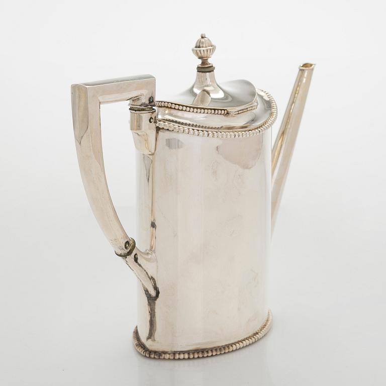 An early 20th century 4- piece sterling silver empire coffee set, C.G. Hallbergs Guldsmeds AB, Stockholm.
