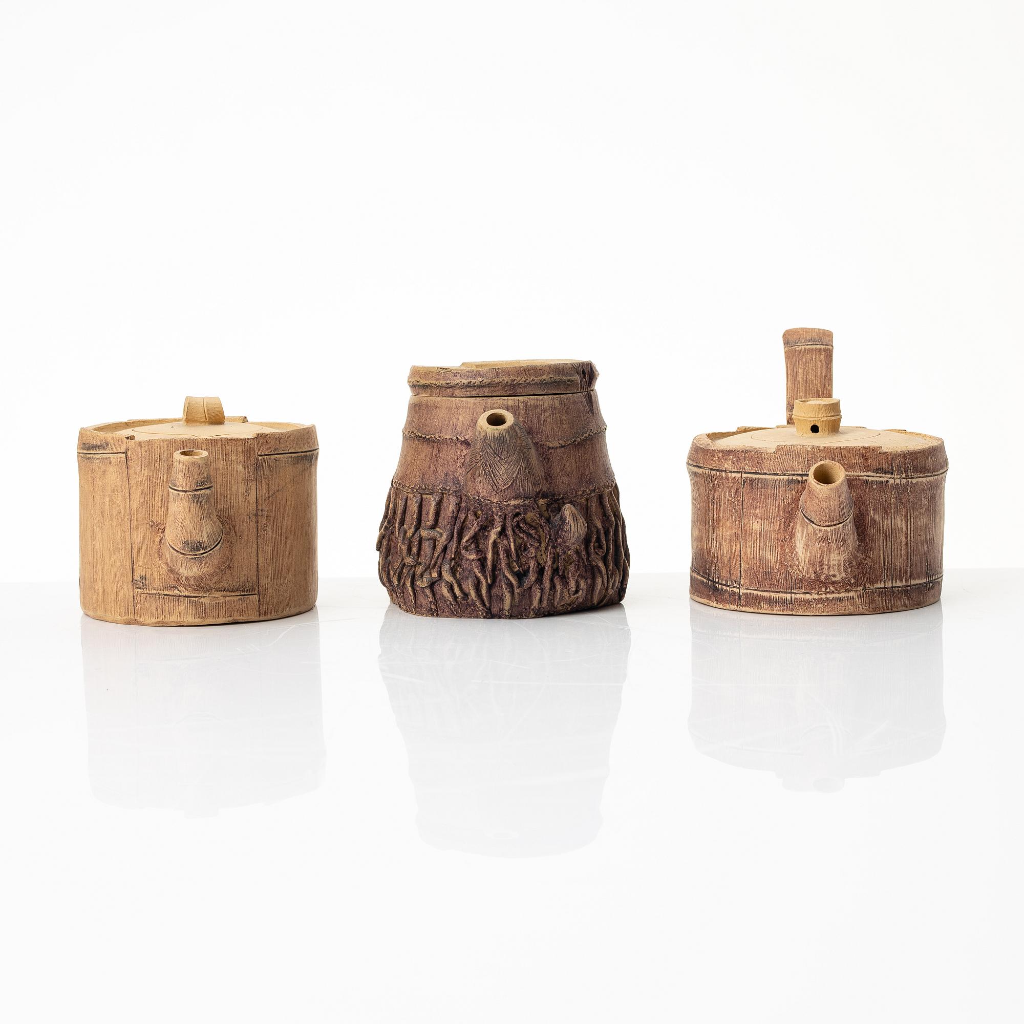 A group of three bright yellow yixing 'Gongfu' teapots, China, 1990s.