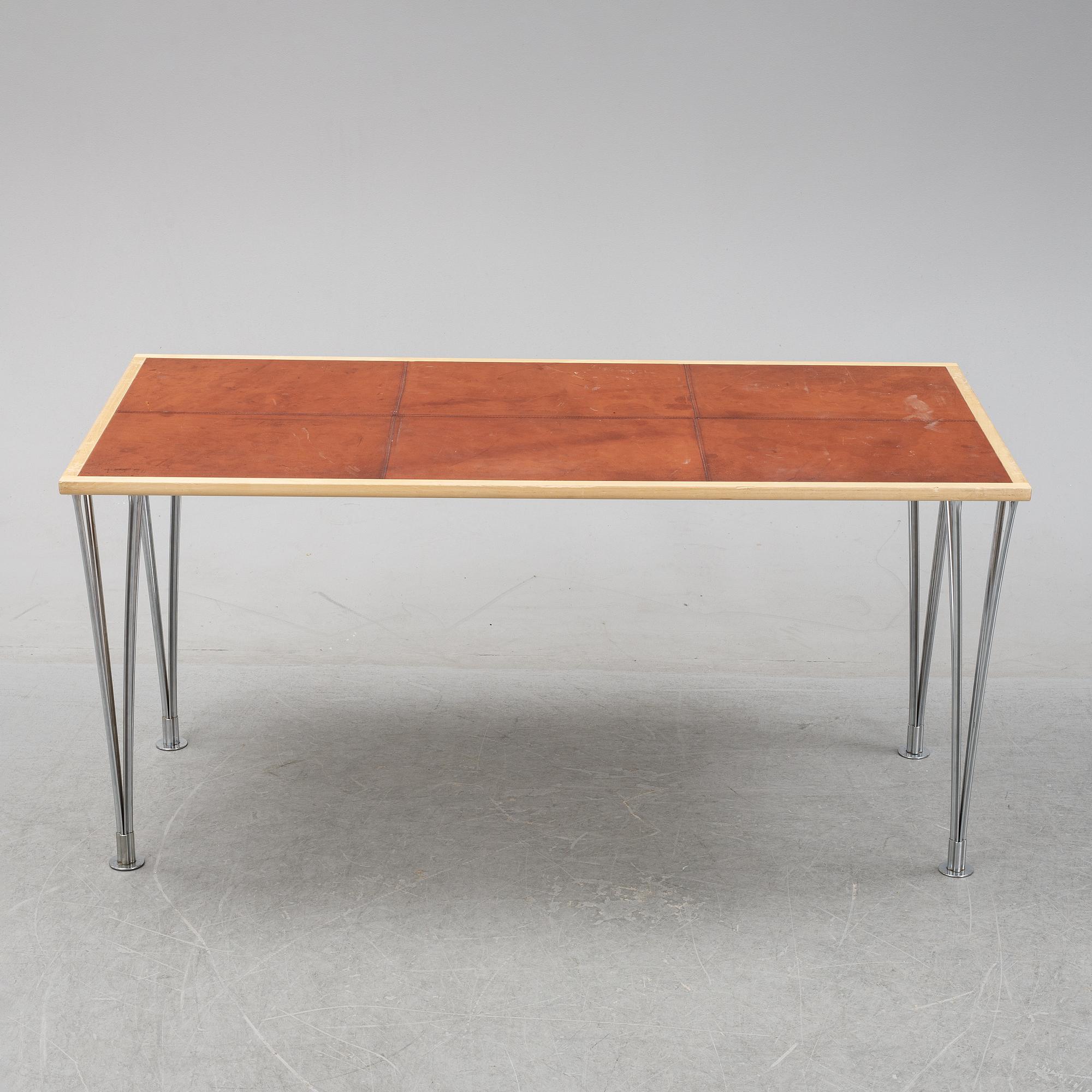 A birch and leather dining table produced by Mathsson International, 21th century.