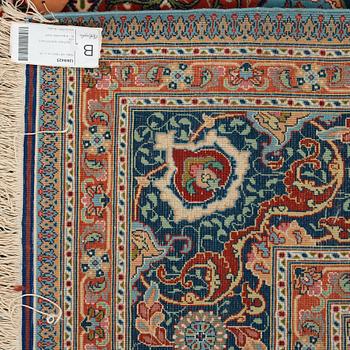 A carpet, an old Tabriz, ca 263,5-266 x 165,5-169,5 cm (as well as 1-1,5 cm blue and terracotta striped flat wear).