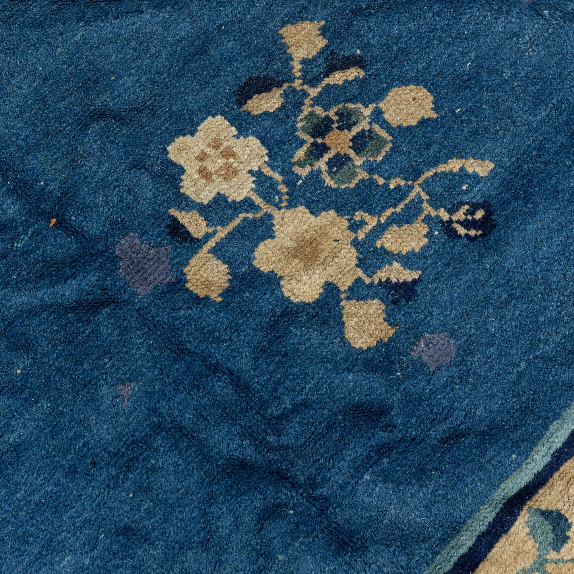 An antique Chinese carpet, c. 355 x 270 cm.