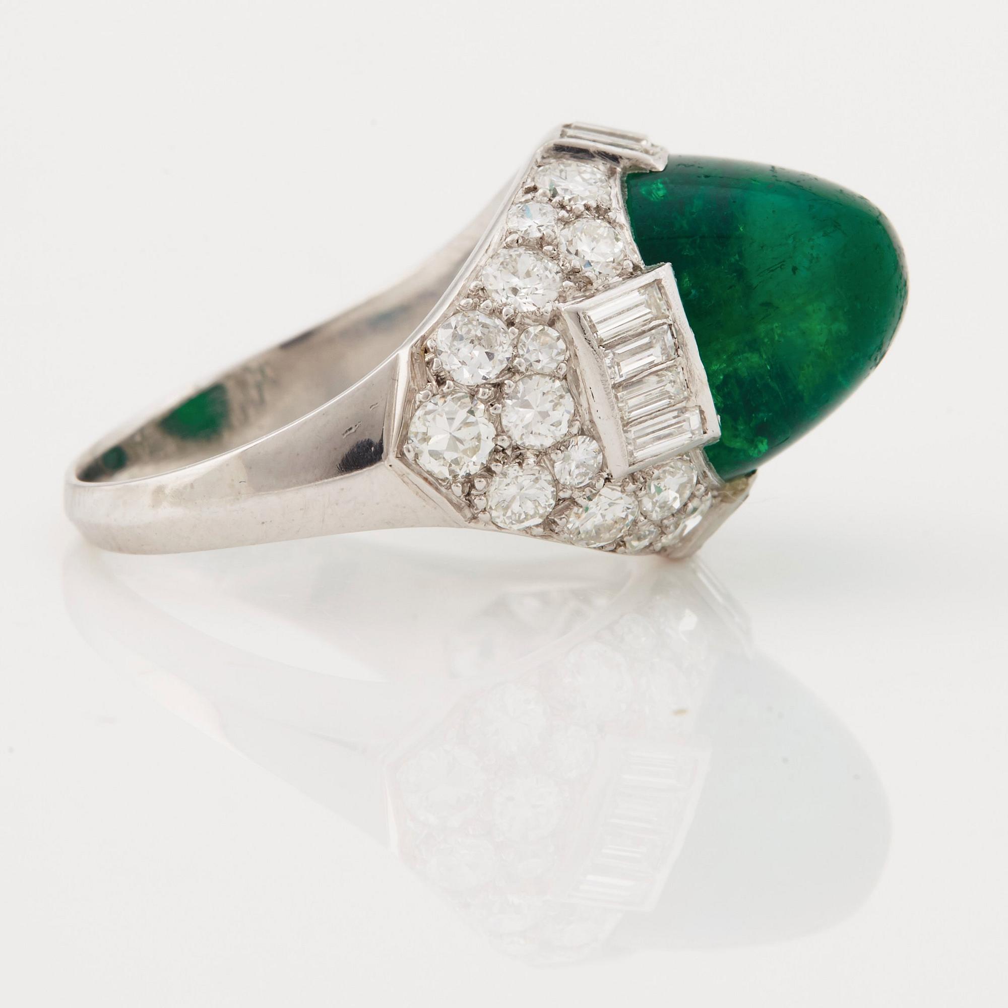 A cabochon-cut emerald, baguette, single and brilliant-cut diamond ring.