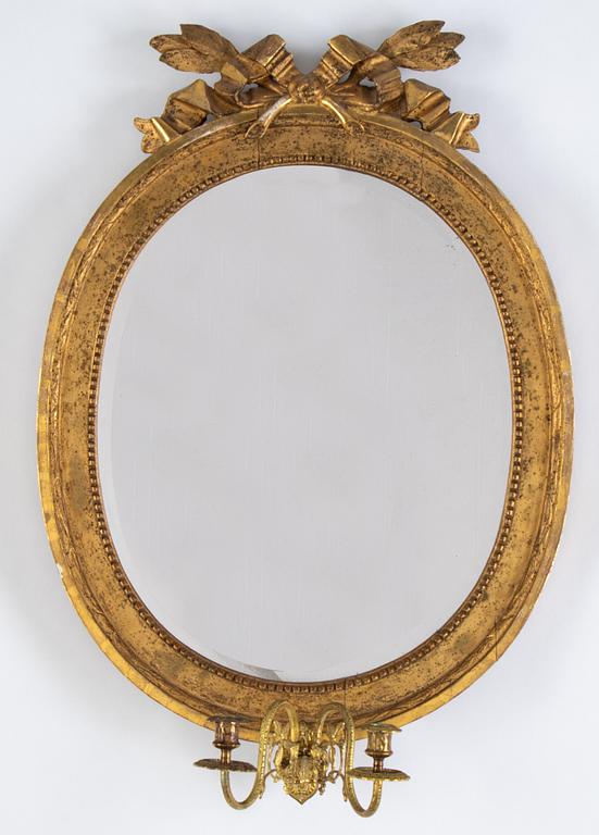 A Gustavian two-light girandole mirror, Stockholm, late 18th century.