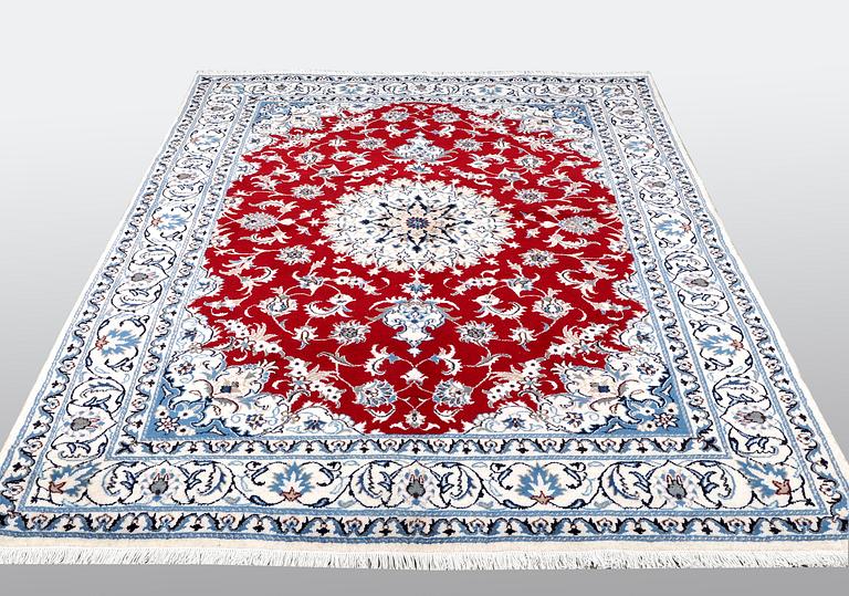 A carpet, Nain, part silk, ca 238 x 170 cm.