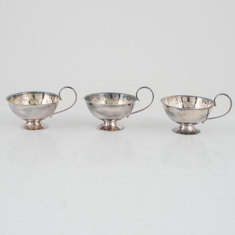 nine silver punsch mugs, Fritz Olsson AB and Ceson, Sweden, 1961, also two silver cups and two silver boxes.