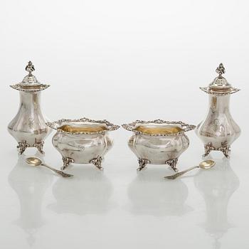 Black Starr & Frost, a pair of sterling silver shakers and sugar bowls, USA around 1900, Gorham pair of sterling spoons.