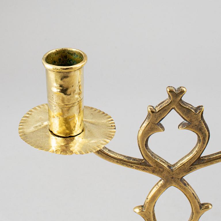 A pair of brass candelabra for two candles "Blekingestakar and a pair of brass cups, 1800/1900.