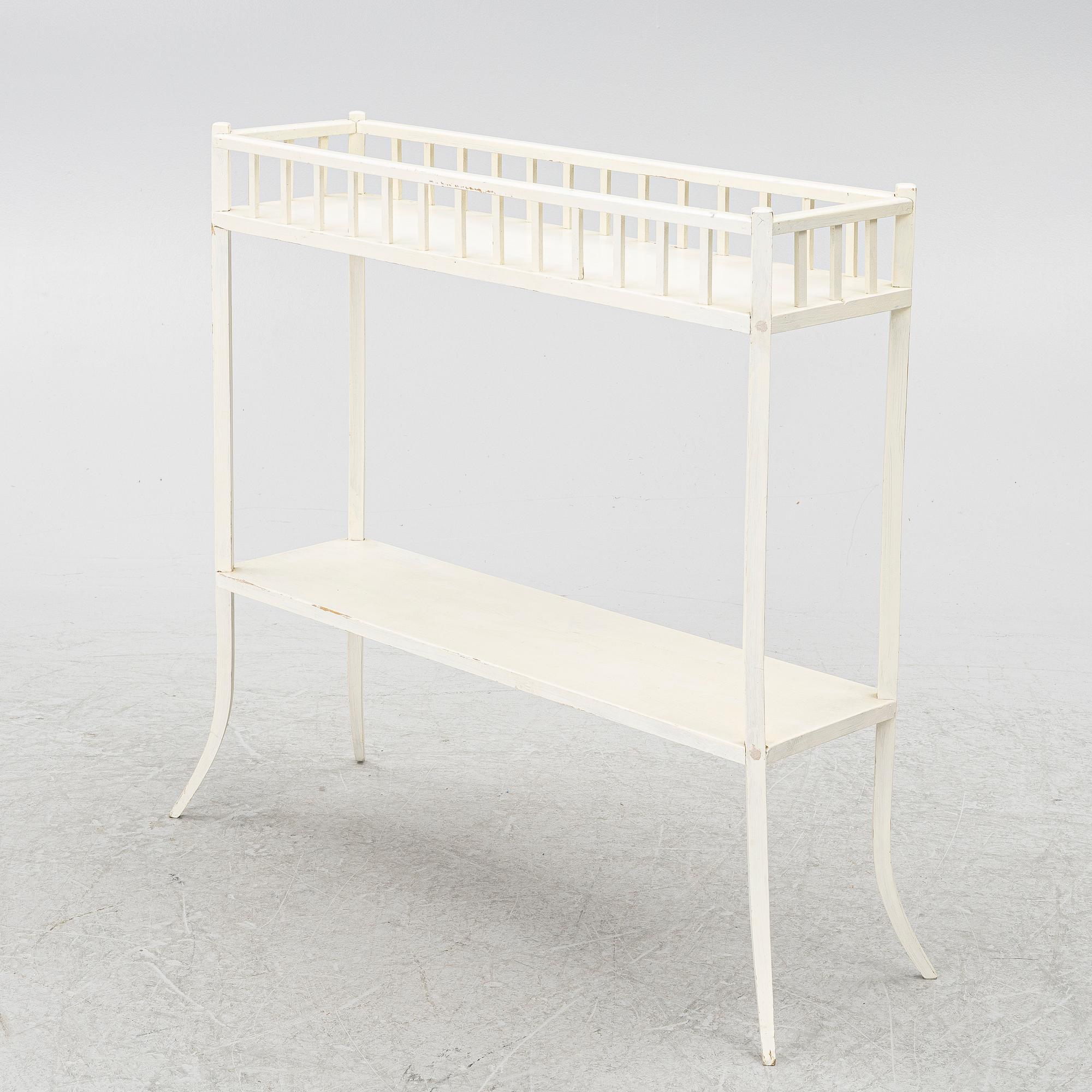 A plant stand, circa 1900.