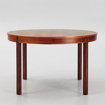 Bertil Fridhagen, a rosewood-veneered dining table with four chairs, BOdsfors, Sweden, 1960's.