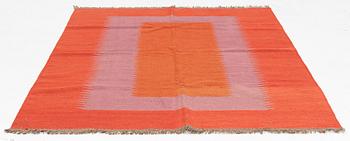 A persian kilim rug, approximately 243 x 179 cm.